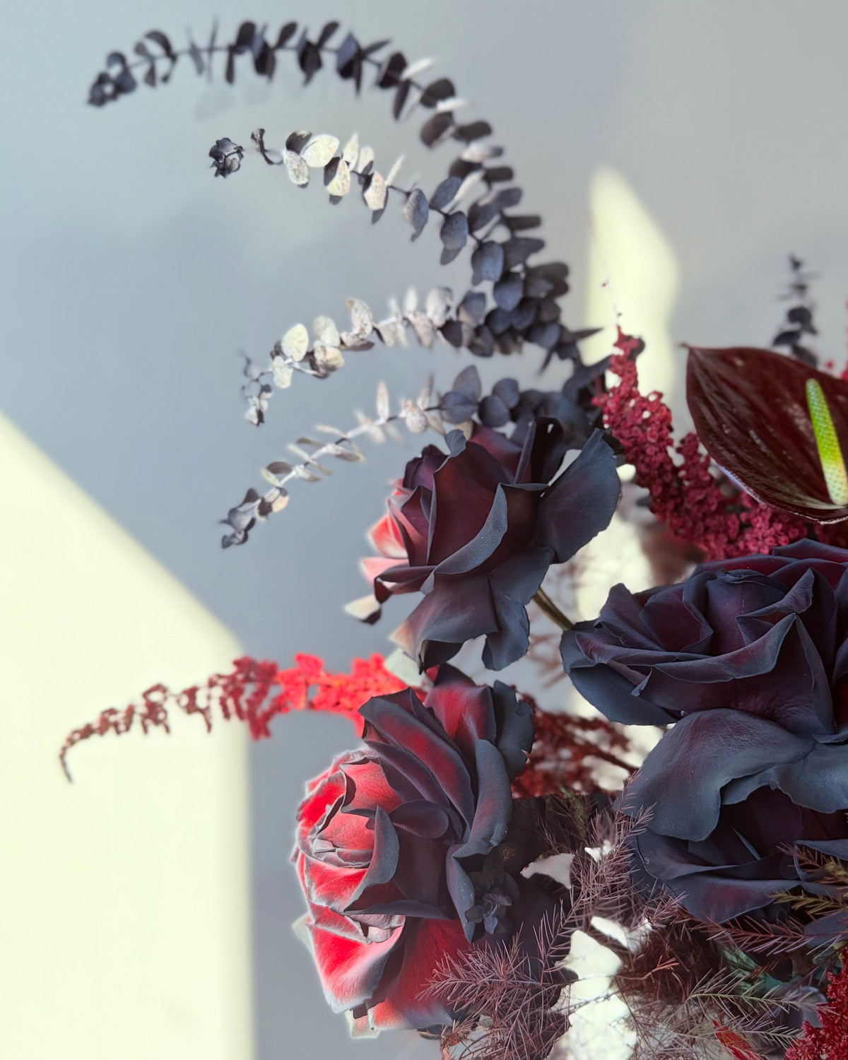 Black Rose Floral Arrangement with Burgundy Accents
