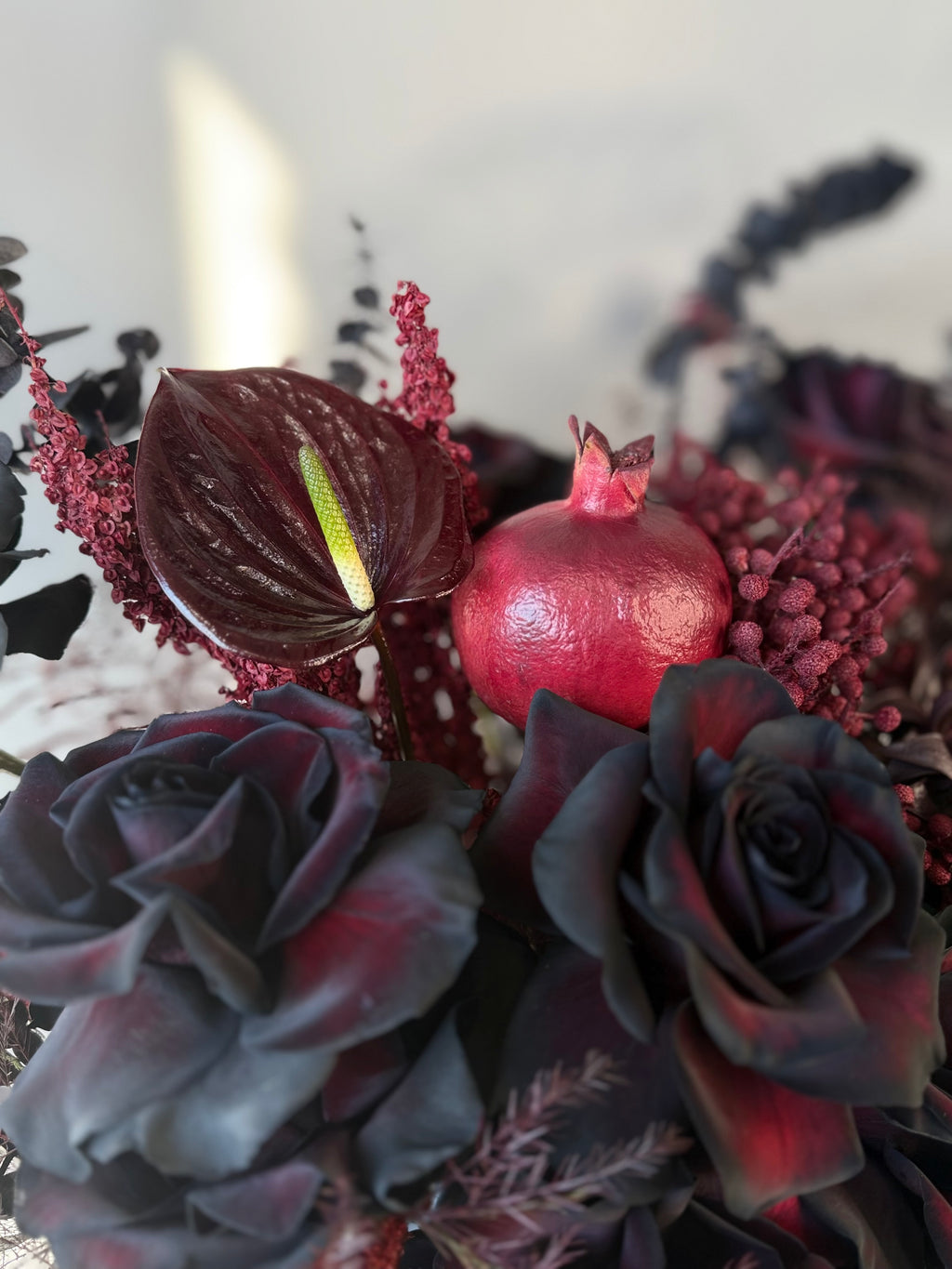 Black Rose Floral Arrangement with Burgundy Accents