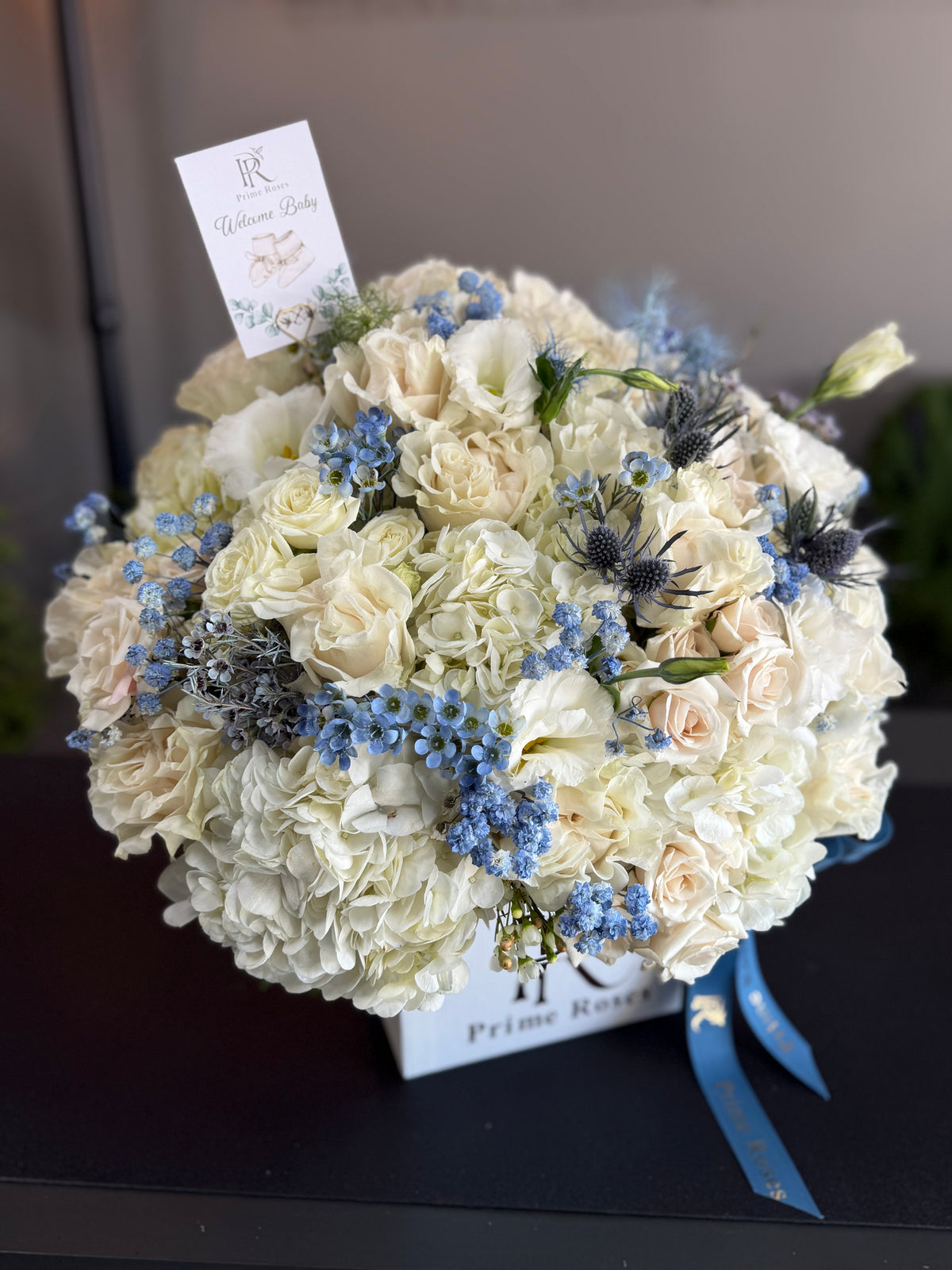 Welcome Baby Boy Floral Arrangement in White and Blue