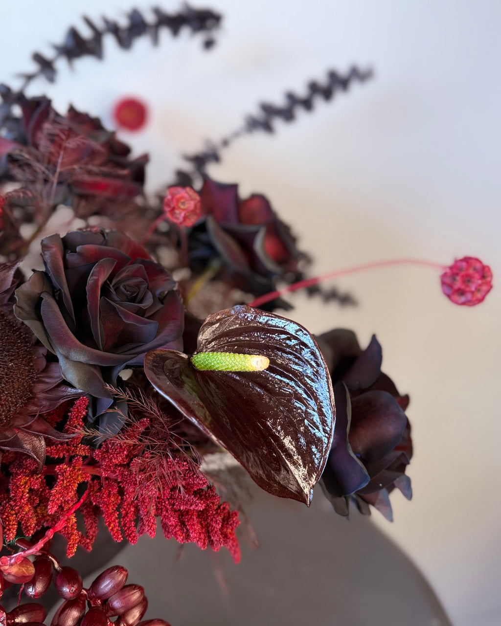 Black Rose Floral Arrangement with Burgundy Accents