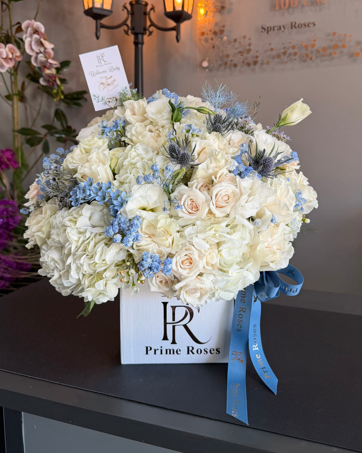 Welcome Baby Boy Floral Arrangement in White and Blue