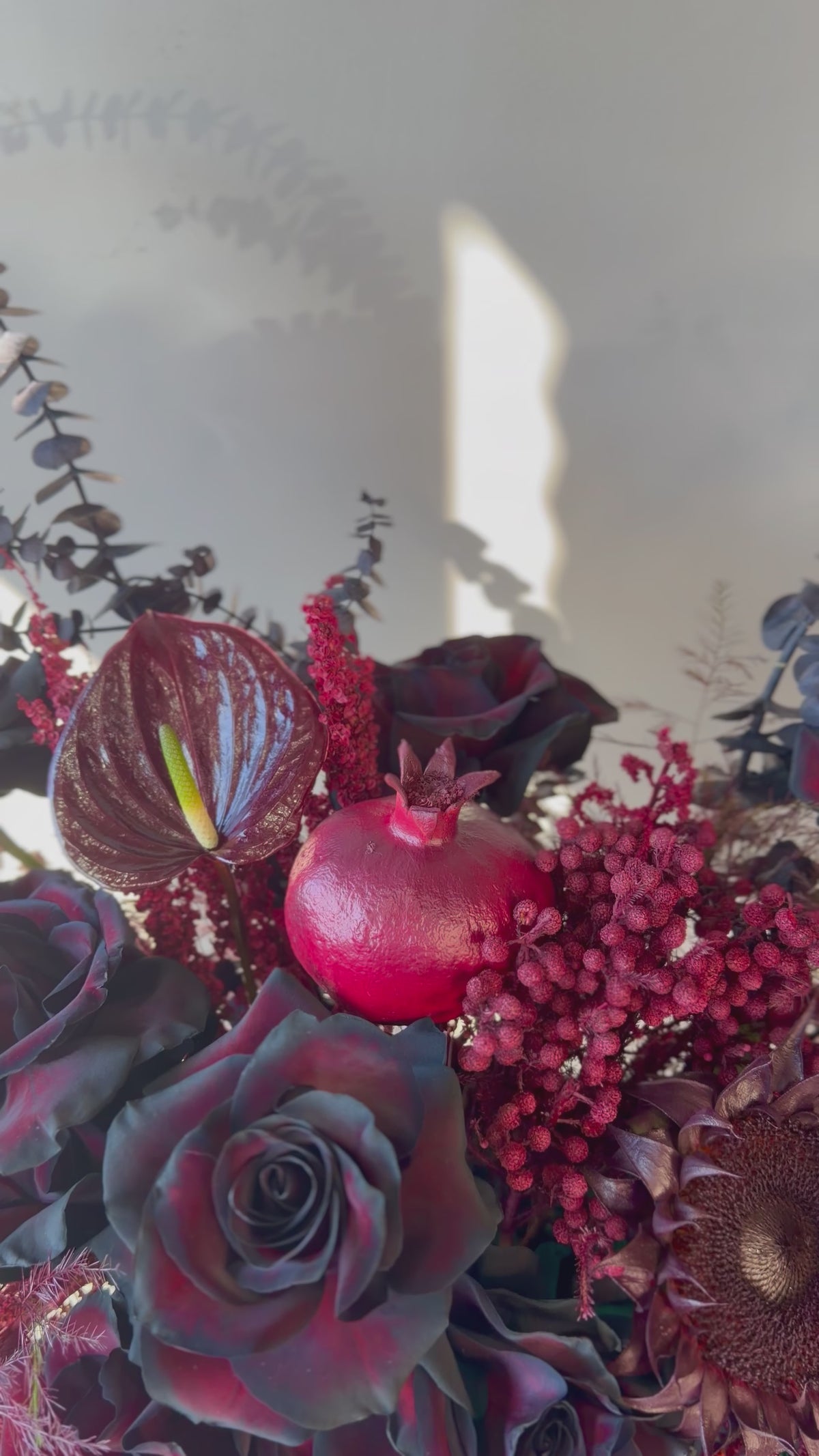 Black Rose Floral Arrangement with Burgundy Accents