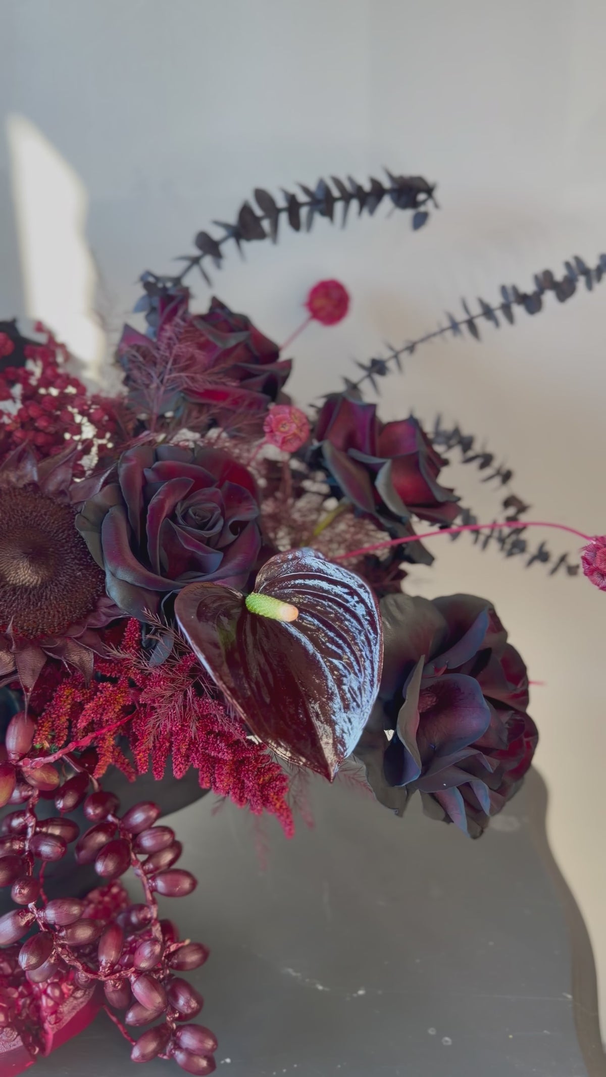 Black Rose Floral Arrangement with Burgundy Accents